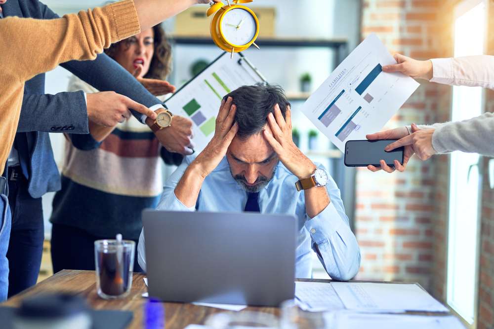 Group,Of,Business,Workers,Working,Together.,Partners,Stressing,One,Of