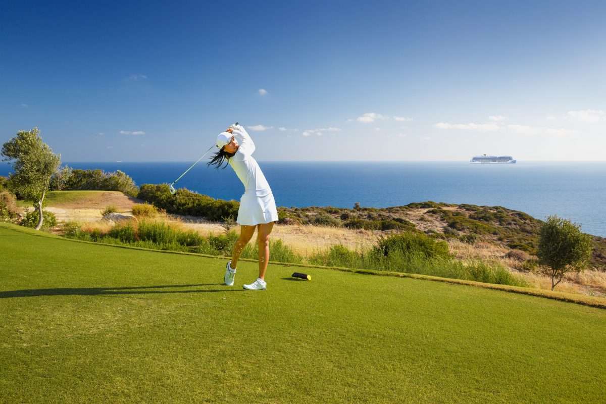 Young,Female,Golf,Player,Playing,On,Green,Course